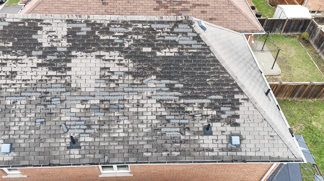 Aerial roof inspection showing shingle wear in Oakville